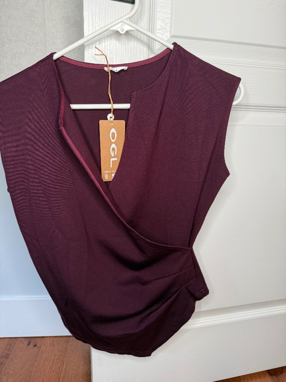 Brand new with tags OGLmove Surplice Wide Shoulder Tucked Angled Tank Top in Dar